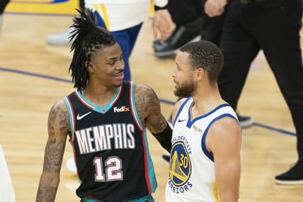 May 16, 2021; San Francisco, California, USA; Memphis Grizzlies guard Ja Morant (12) talks to Golden State Warriors guard Stephen Curry (30) after the game at Chase Center. Mandatory Credit: Kyle Terada-USA TODAY Sports