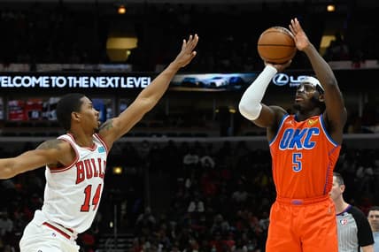Feb 12, 2022; Chicago, Illinois, USA;  Chicago Bulls forward Malcolm Hill (14) defends against Oklahoma City Thunder forward Luguentz Dort (5) during the second half at the United Center. Mandatory Credit: Matt Marton-USA TODAY Sports