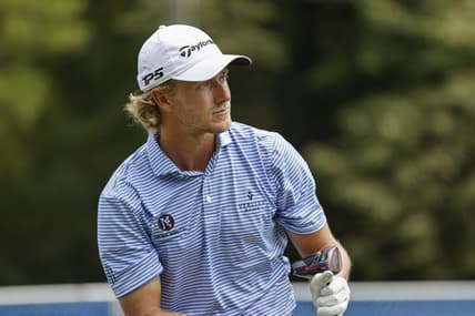 Aug 4, 2022; Greensboro, North Carolina, USA; Austin Smotherman watches his tee shot on the 18th tee during the first round of the Wyndham Championship golf tournament. Mandatory Credit: Nell Redmond-USA TODAY Sports
