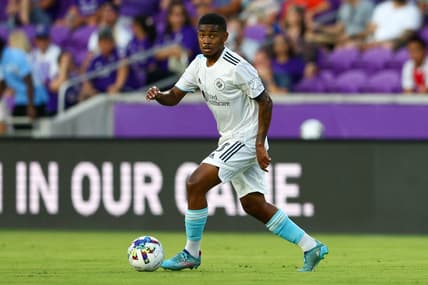 Aug 6, 2022; Orlando, Florida, USA;  New England Revolution midfielder Maciel (13) controls the ball against Orlando City in the first half at Exploria Stadium. Mandatory Credit: Nathan Ray Seebeck-USA TODAY Sports
