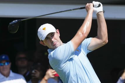 Sep 22, 2022; Charlotte, North Carolina, USA; Team USA golfer Patrick Cantlay hits his tee shot on the first hole during the foursomes match play of the Presidents Cup golf tournament at Quail Hollow Club. Mandatory Credit: Jim Dedmon-USA TODAY Sports
