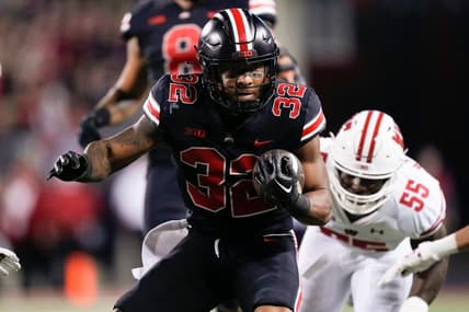 Sep 24, 2022; Columbus, Ohio, USA; Ohio State Buckeyes running back TreVeyon Henderson (32) runs past Wisconsin Badgers linebacker Maema Njongmeta (55) during the first half of the NCAA Division I football game at Ohio Stadium. Mandatory Credit: Adam Cairns-The Columbus Dispatch

Ncaa Football Wisconsin Badgers At Ohio State Buckeyes