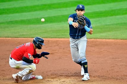 Sep 29, 2022; Cleveland, Ohio, USA; Tampa Bay Rays second baseman Jonathan Aranda (62) throws to first base after forcing out of Cleveland Guardians second baseman Andres Gimenez (0) in the second inning at Progressive Field. Mandatory Credit: David Richard-USA TODAY Sports