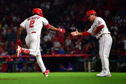 Sep 30, 2022; Anaheim, California, USA; Los Angeles Angels third baseman Luis Rengifo (2) is greeted by third base coach Mike Gallego (86) after hitting a solo home run against the Texas Rangers during the third inning at Angel Stadium. Mandatory Credit: Gary A. Vasquez-USA TODAY Sports