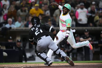Sep 30, 2022; San Diego, California, USA; San Diego Padres left fielder Jurickson Profar (10) is tagged out at home by Chicago White Sox catcher Carlos Perez (21) during the fifth inning at Petco Park. Mandatory Credit: Orlando Ramirez-USA TODAY Sports