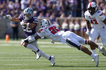 Oct 1, 2022; Manhattan, Kansas, USA; Kansas State Wildcats running back Deuce Vaughn (22) runs against Texas Tech Red Raiders defensive back Dadrion Taylor-Demerson (25) during the first quarter at Bill Snyder Family Football Stadium. Mandatory Credit: Scott Sewell-USA TODAY Sports