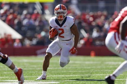 Oct 1, 2022; Madison, Wisconsin, USA;  Illinois Fighting Illini running back Chase Brown (2) rushes with the football during the second quarter against the Wisconsin Badgers at Camp Randall Stadium. Mandatory Credit: Jeff Hanisch-USA TODAY Sports