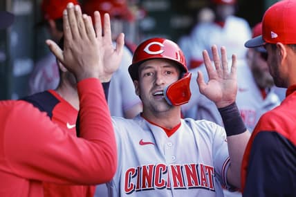 Oct 1, 2022; Chicago, Illinois, USA; Cincinnati Reds first baseman Spencer Steer (12) celebrates with teammates after scoring against the Chicago Cubs during the third inning at Wrigley Field. Mandatory Credit: Kamil Krzaczynski-USA TODAY Sports