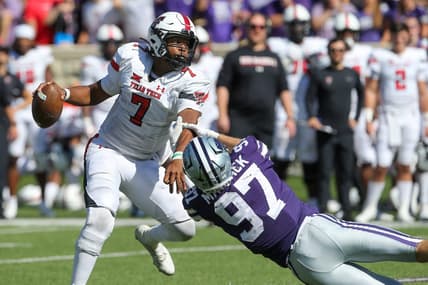 Oct 1, 2022; Manhattan, Kansas, USA; Texas Tech Red Raiders quarterback Donovan Smith (7) breaks away from Kansas State Wildcats defensive end Nate Matlack (97) during the fourth quarter at Bill Snyder Family Football Stadium. Mandatory Credit: Scott Sewell-USA TODAY Sports