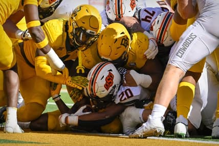 Oct 1, 2022; Waco, Texas, USA; The Baylor Bears defense stops Oklahoma State Cowboys running back Dominic Richardson (20) short of the end zone during the second quarter at McLane Stadium. Mandatory Credit: Jerome Miron-USA TODAY Sports