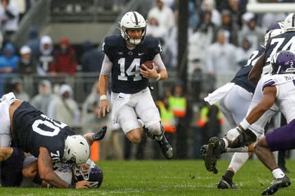 Oct 1, 2022; University Park, Pennsylvania, USA; Penn State Nittany Lions quarterback Sean Clifford (14) runs with the ball during the first quarter against the Northwestern Wildcats at Beaver Stadium. Mandatory Credit: Matthew OHaren-USA TODAY Sports