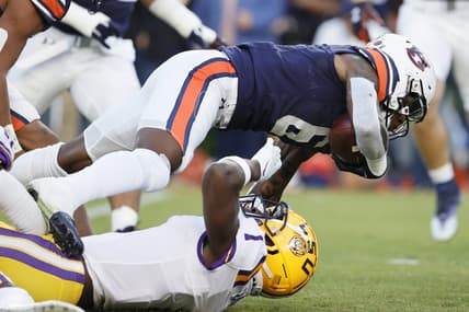 Oct 1, 2022; Auburn, Alabama, USA;  Auburn Tigers cornerback Keionte Scott (6) is tackled by LSU Tigers cornerback Sevyn Banks (1) during the first quarter at Jordan-Hare Stadium. Mandatory Credit: John Reed-USA TODAY Sports