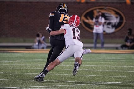 Oct 1, 2022; Columbia, Missouri, USA; Missouri Tigers defensive back Daylan Carnell (13) is tackled by Georgia Bulldogs quarterback Stetson Bennett (13) after Carnell s interception during the first half at Faurot Field at Memorial Stadium. Mandatory Credit: Denny Medley-USA TODAY Sports