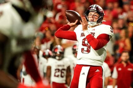 Oct 1, 2022; Lincoln, Nebraska, USA; Indiana Hoosiers quarterback Connor Bazelak (9) throws a touchdown pass during the second quarter  against the Nebraska Cornhuskers at Memorial Stadium. Mandatory Credit: Dylan Widger-USA TODAY Sports