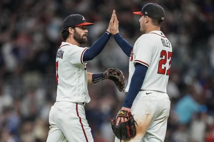 Oct 1, 2022; Cumberland, Georgia, USA; Atlanta Braves shortstop Dansby Swanson (7) reacts with third baseman Austin Riley (27) after the Braves defeated the New York Mets at Truist Park. Mandatory Credit: Dale Zanine-USA TODAY Sports