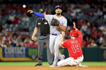 Oct 1, 2022; Anaheim, California, USA;  Texas Rangers second baseman Marcus Semien (2) forces out Los Angeles Angels third baseman Livan Soto (13) at second while attempting to complete a double play during the fifth inning at Angel Stadium. Mandatory Credit: Kiyoshi Mio-USA TODAY Sports