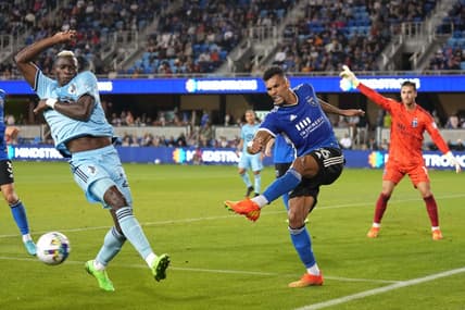 Oct 1, 2022; San Jose, California, USA; San Jose Earthquakes defender Rodrigues (26) clears the ball against Minnesota United forward Mender Garcia (28) during the first half at PayPal Park. Mandatory Credit: Darren Yamashita-USA TODAY Sports