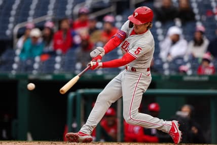 Oct 2, 2022; Washington, District of Columbia, USA; Philadelphia Phillies shortstop Bryson Stott (5) hits an RBI single against the Washington Nationals during the second inning at Nationals Park. Mandatory Credit: Scott Taetsch-USA TODAY Sports