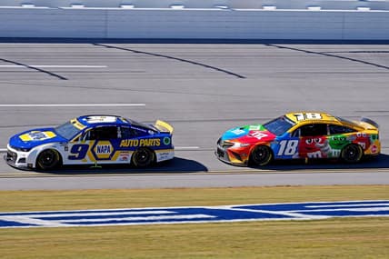 Oct 2, 2022; Talladega, Alabama, USA; NASCAR Cup Series driver Chase Elliott (9) and NASCAR Cup Series driver Kyle Busch (18) during the Yellawood 500 at Talladega Superspeedway. Mandatory Credit: Jasen Vinlove-USA TODAY Sports