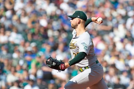 Oct 2, 2022; Seattle, Washington, USA; Oakland Athletics starting pitcher James Kaprielian (32) pitches to the Seattle Mariners during the first inning at T-Mobile Park. Mandatory Credit: Steven Bisig-USA TODAY Sports