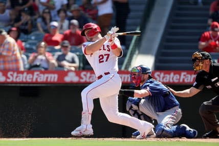 Oct 2, 2022; Anaheim, California, USA; Los Angeles Angels center fielder Mike Trout (27) hits a single during the first inning against the Texas Rangers at Angel Stadium. Mandatory Credit: Kiyoshi Mio-USA TODAY Sports