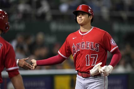 Oct 3, 2022; Oakland, California, USA; Los Angeles Angels designated hitter Shohei Ohtani (17) receives congratulations after scoring a run against the Oakland Athletics during the fourth inning at RingCentral Coliseum. Mandatory Credit: Darren Yamashita-USA TODAY Sports