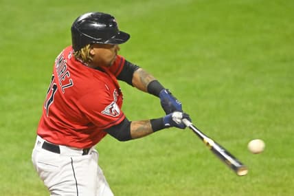 Oct 4, 2022; Cleveland, Ohio, USA; Cleveland Guardians designated hitter Jose Ramirez (11) hits a two-RBI double in the fifth inning against the Kansas City Royals at Progressive Field. Mandatory Credit: David Richard-USA TODAY Sports