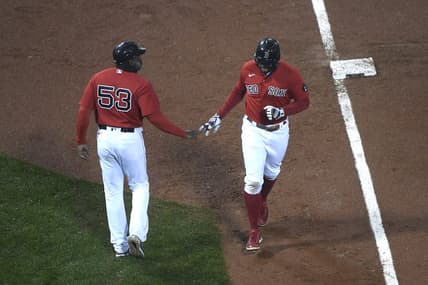 Oct 4, 2022; Boston, Massachusetts, USA;  Boston Red Sox shortstop Xander Bogaerts (2) is congratulated by third base coach Carlos Febles (53) after hitting a grand slam during the fifth inning at Fenway Park. Mandatory Credit: Bob DeChiara-USA TODAY Sports