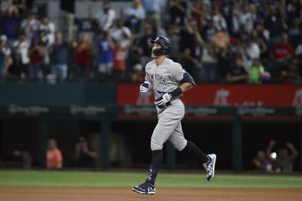 Oct 4, 2022; Arlington, Texas, USA; New York Yankees right fielder Aaron Judge (99) rounds the bases after hitting home run number sixty-two to break the American League home run record in the first inning against the Texas Rangers at Globe Life Field. Mandatory Credit: Tim Heitman-USA TODAY Sports