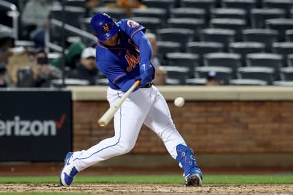 Oct 4, 2022; New York City, New York, USA; New York Mets catcher Francisco Alvarez (50) hits a solo home run against the Washington Nationals during the sixth inning at Citi Field. The home run was the first of his major league career. Mandatory Credit: Brad Penner-USA TODAY Sports