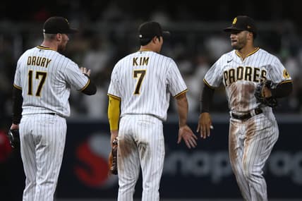 Oct 4, 2022; San Diego, California, USA; San Diego Padres center fielder Trent Grisham (right) celebrates with shortstop Ha-Seong Kim (7) and second baseman Brandon Drury (17) after defeating the San Francisco Giants at Petco Park. Mandatory Credit: Orlando Ramirez-USA TODAY Sports