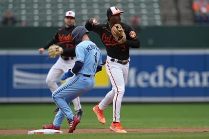 Oct 5, 2022; Baltimore, MD, USA; Baltimore Orioles shortstop Jorge Mateo (3) forces out Toronto Blue Jays second baseman Whit Merrifield (1) to start a second inning double play at Oriole Park at Camden Yards. Mandatory Credit: Mitch Stringer-USA TODAY Sports