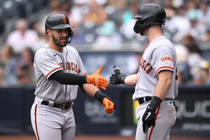 Oct 5, 2022; San Diego, California, USA; San Francisco Giants designated hitter David Villar (left) is congratulated by designated hitter Joey Bart (21) after hitting a home run against the San Diego Padres during the eighth inning at Petco Park. Mandatory Credit: Orlando Ramirez-USA TODAY Sports