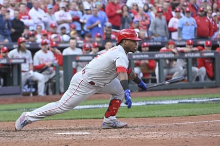 Oct 7, 2022; St. Louis, Missouri, USA; Philadelphia Phillies second baseman Jean Segura (2) hits a single during the ninth inning that scored the go ahead run against the St. Louis Cardinals during game one of the Wild Card series for the 2022 MLB Playoffs at Busch Stadium. Mandatory Credit: Jeff Curry-USA TODAY Sports