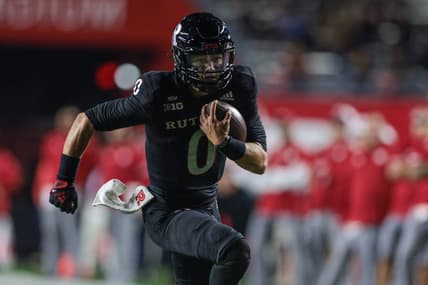 Oct 7, 2022; Piscataway, New Jersey, USA; Rutgers Scarlet Knights quarterback Noah Vedral (0) scores a rushing touchdown during the first half against the Nebraska Cornhuskers at SHI Stadium. Mandatory Credit: Vincent Carchietta-USA TODAY Sports