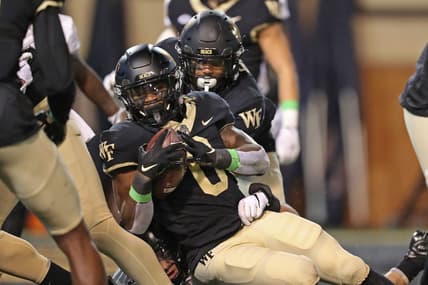 Oct 8, 2022; Winston-Salem, North Carolina, USA; Wake Forest Demon Deacons running back Christian Turner (0) crosses the goal line for a touchdown against the Army Black Knights during the first half at Truist Field. Mandatory Credit: Danny Wild-USA TODAY Sports