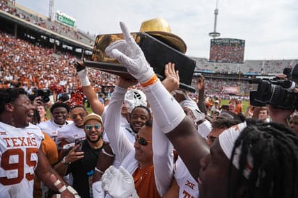 Oct 8, 2022; Dallas, Texas, USA: Texas Longhorns Longhorns head coach Steve Sarkisian holds up the Golden Hat trophy after a 49-0 victory over the Oklahoma Sooners in the annual Red River Showdown at the Cotton Bowl. Mandatory Credit: Aaron E. Martinez/Austin American-Statesman- USA TODAY NETWORK