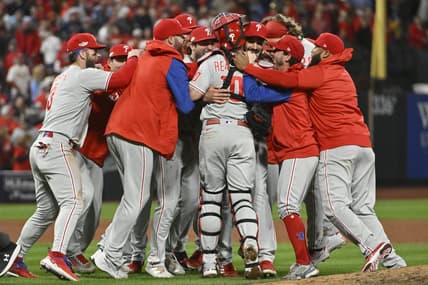 Oct 8, 2022; St. Louis, Missouri, USA; Members of the Philadelphia Phillies celebrate following their 2-0 victory against the St. Louis Cardinals in game two of the Wild Card series for the 2022 MLB Playoffs at Busch Stadium. Mandatory Credit: Jeff Curry-USA TODAY Sports