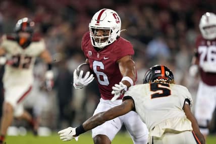 Oct 8, 2022; Stanford, California, USA; Stanford Cardinal wide receiver Elijah Higgins (6) runs after a catch against Oregon State Beavers defensive back Alex Austin (5) during the second quarter at Stanford Stadium. Mandatory Credit: Darren Yamashita-USA TODAY Sports