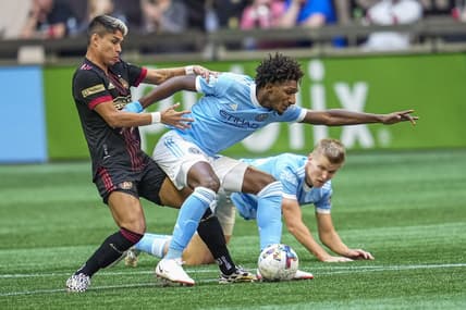 Oct 9, 2022; Atlanta, Georgia, USA; Atlanta United midfielder Luiz Araujo (19) and New York City FC forward Talles Magno (43) battle for the ball in the first half at Mercedes-Benz Stadium. Mandatory Credit: Dale Zanine-USA TODAY Sports