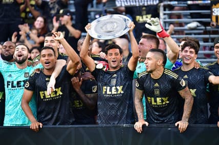 Oct 9, 2022; Los Angeles, California, USA; Los Angeles FC forward Carlos Vela (10) lifts the MLS Supporters Shield following the match against Nashville SC at Banc of California Stadium. Mandatory Credit: Gary A. Vasquez-USA TODAY Sports