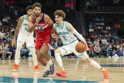 Oct 10, 2022; Charlotte, North Carolina, USA;  Charlotte Hornets guard LaMelo Ball (1) drives the lane against Washington Wizards forward Anthony Gill (16) during the second half at Spectrum Center. Mandatory Credit: Jim Dedmon-USA TODAY Sports