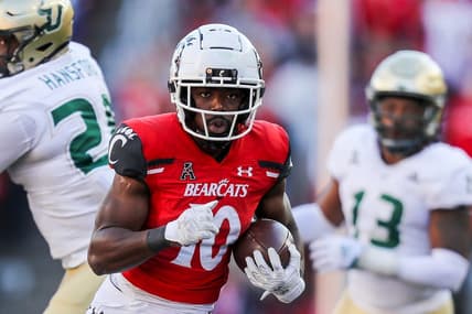 Oct 8, 2022; Cincinnati, Ohio, USA; Cincinnati Bearcats running back Charles McClelland (10) runs with the ball against the South Florida Bulls in the second half at Nippert Stadium. Mandatory Credit: Katie Stratman-USA TODAY Sports