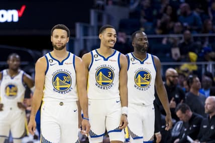 Oct 14, 2022; San Francisco, California, USA;  Golden State Warriors guard Jordan Poole (3) and guard Stephen Curry (30) and forward Draymond Green (23) re-enter the court after a time-out during the first half of the game against the Denver Nuggets at Chase Center. Mandatory Credit: John Hefti-USA TODAY Sports