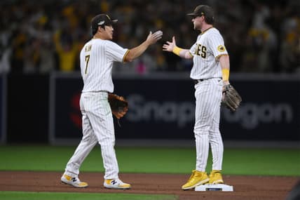 Oct 14, 2022; San Diego, California, USA; San Diego Padres shortstop Ha-Seong Kim (7) and second baseman Jake Cronenworth (9) celebrate defeating the Los Angeles Dodgers during game three of the NLDS for the 2022 MLB Playoffs at Petco Park. Mandatory Credit: Orlando Ramirez-USA TODAY Sports