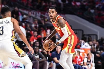 Oct 14, 2022; Birmingham, Alabama, USA; Atlanta Hawks guard Dejounte Murray (5) prepares to drive on New Orleans Pelicans guard CJ McCollum (3) in the first quarter at Legacy Arena at BJCC. Mandatory Credit: Larry Robinson-USA TODAY Sports