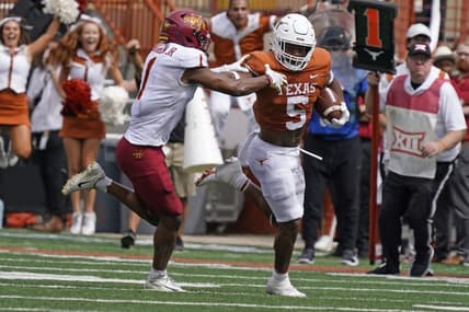 Oct 15, 2022; Austin, Texas, USA; Texas Longhorns running back Bijan Robinson (5) runs for yardage against Iowa State Cyclones defensive back Anthony Johnson, Jr.  (1) during the first half at Darrell K Royal-Texas Memorial Stadium. Mandatory Credit: Scott Wachter-USA TODAY Sports