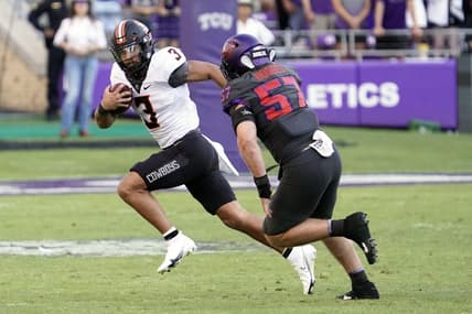 Oct 15, 2022; Fort Worth, Texas, USA; Oklahoma State Cowboys quarterback Spencer Sanders (3) tries to the turn the corner on TCU Horned Frogs linebacker Johnny Hodges (57) during the second half at Amon G. Carter Stadium. Mandatory Credit: Raymond Carlin III-USA TODAY Sports