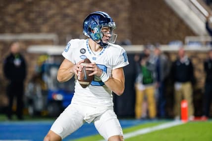 Oct 15, 2022; Durham, North Carolina, USA;  North Carolina Tar Heels quarterback Drake Maye (10) with the football during the first half at Wallace Wade Stadium. Mandatory Credit: Jaylynn Nash-USA TODAY Sports