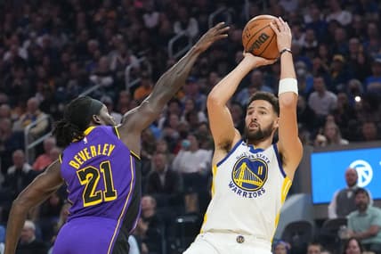 October 18, 2022; San Francisco, California, USA; Golden State Warriors guard Klay Thompson (11) shoots the basketball against Los Angeles Lakers guard Patrick Beverley (21) during the first quarter at Chase Center. Mandatory Credit: Kyle Terada-USA TODAY Sports